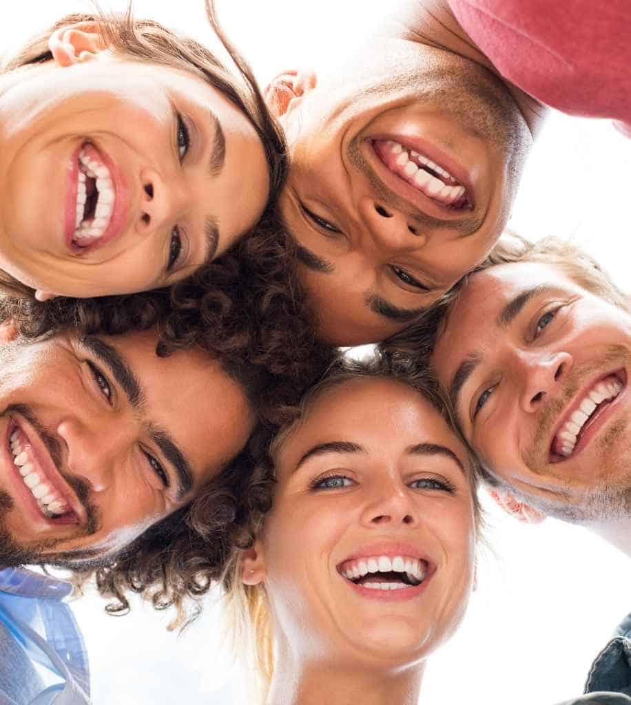 Smiling person showcasing white teeth after laser whitening treatment Towcester